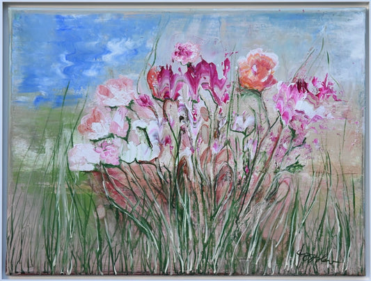 Eine Gruppe von Blumen auf einer Wiese